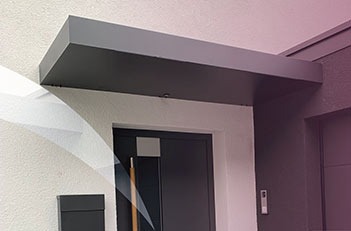 black aluminium canopy above a door